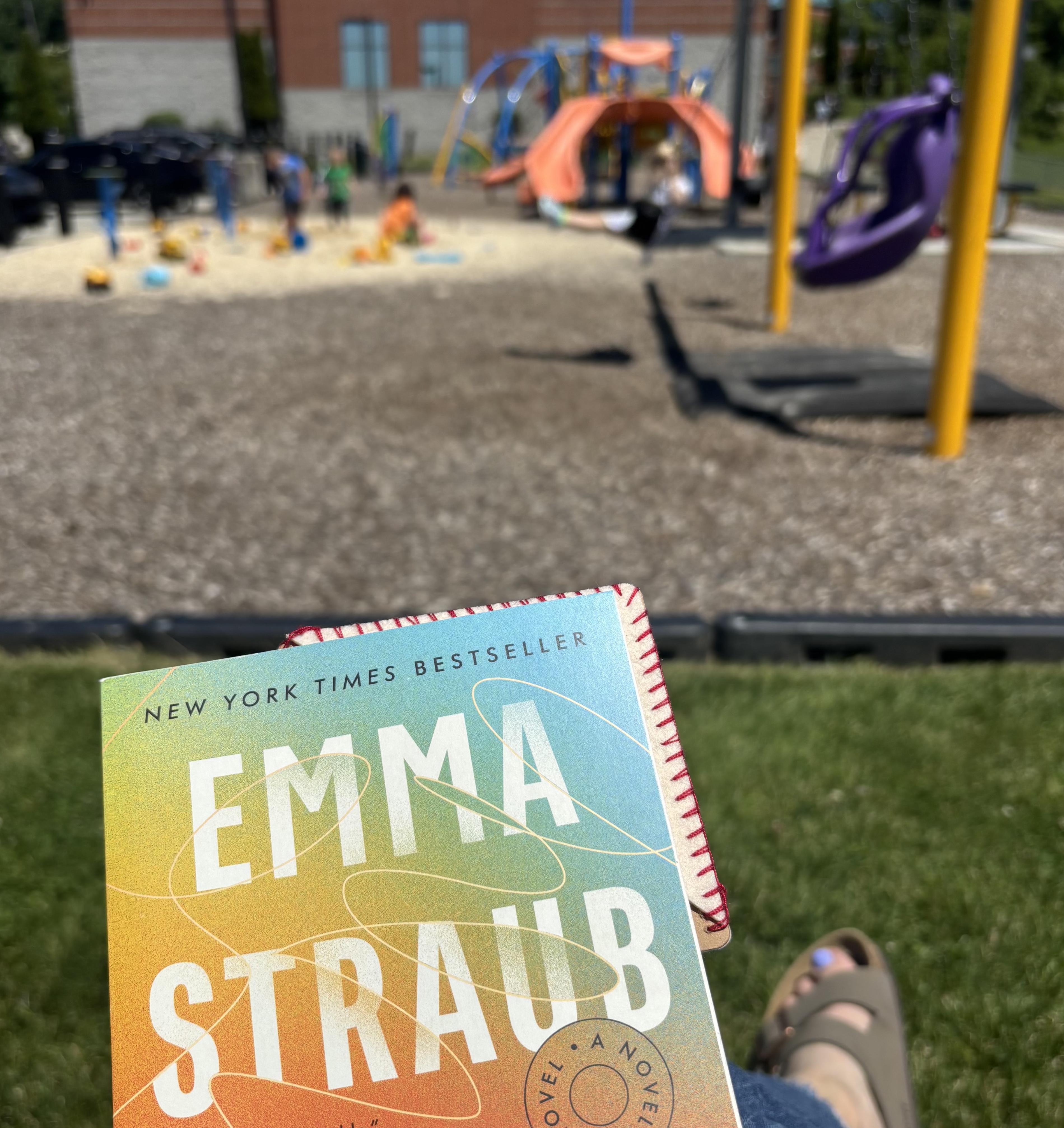 Reading a book at the playground